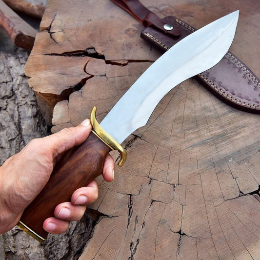 stainless steel hunting knife with rosewood handle held outdoors – SXH 1115