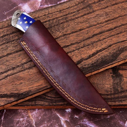 "Damascus Hunting Knife Safely Encased in Premium Leather Sheath – Secure and Stylish Carry Option"