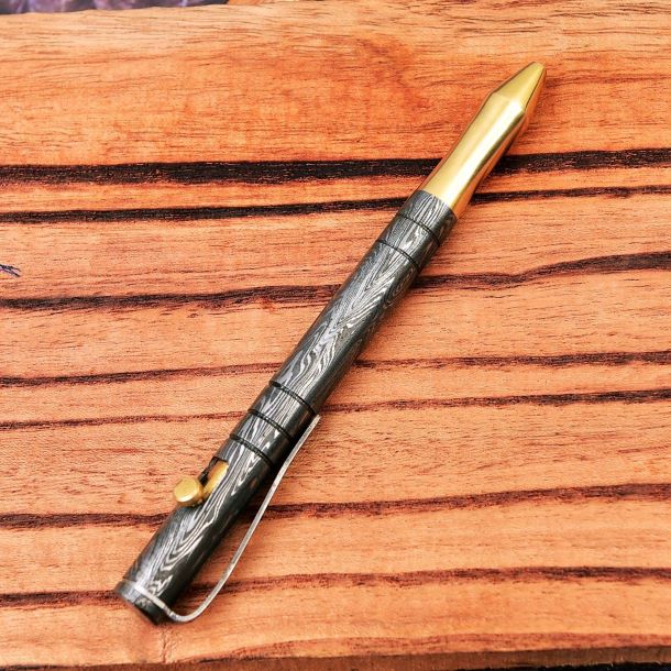 Crafted Brilliance - Sharp Edge’s Handmade Bolt Action Damascus Steel and Brass Pen.