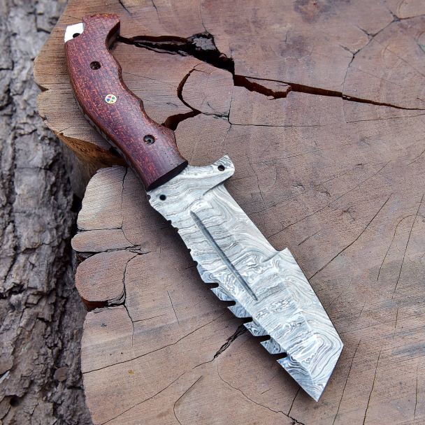 Top view of Damascus tracker knife revealing aggressive multi-zone blade design – DXH-1101