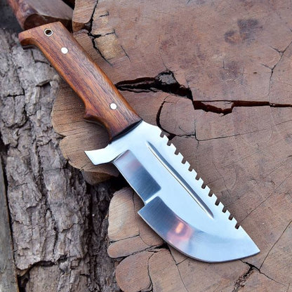 Tracker-style stainless steel blade of SXH1104 knife displayed from top angle highlighting sharp edge geometry.