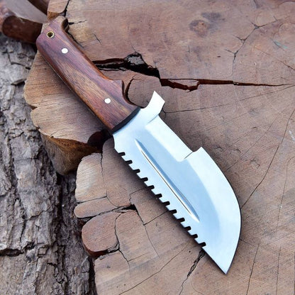 SXH1104 outdoor adventure shot showing stainless steel hunting knife placed on wood with natural lighting.